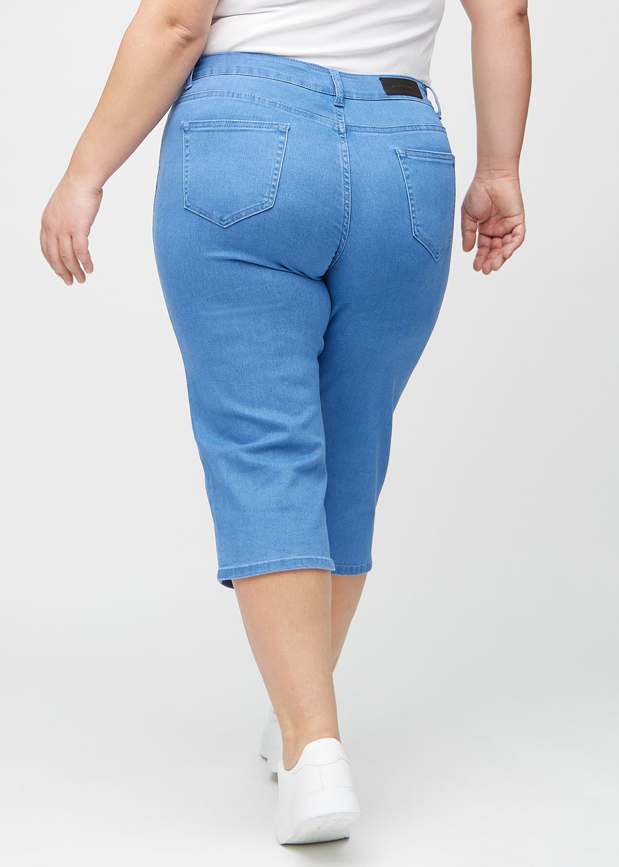 Blue regular capris seen from the back on a plus-size model, so the entire product can be seen.