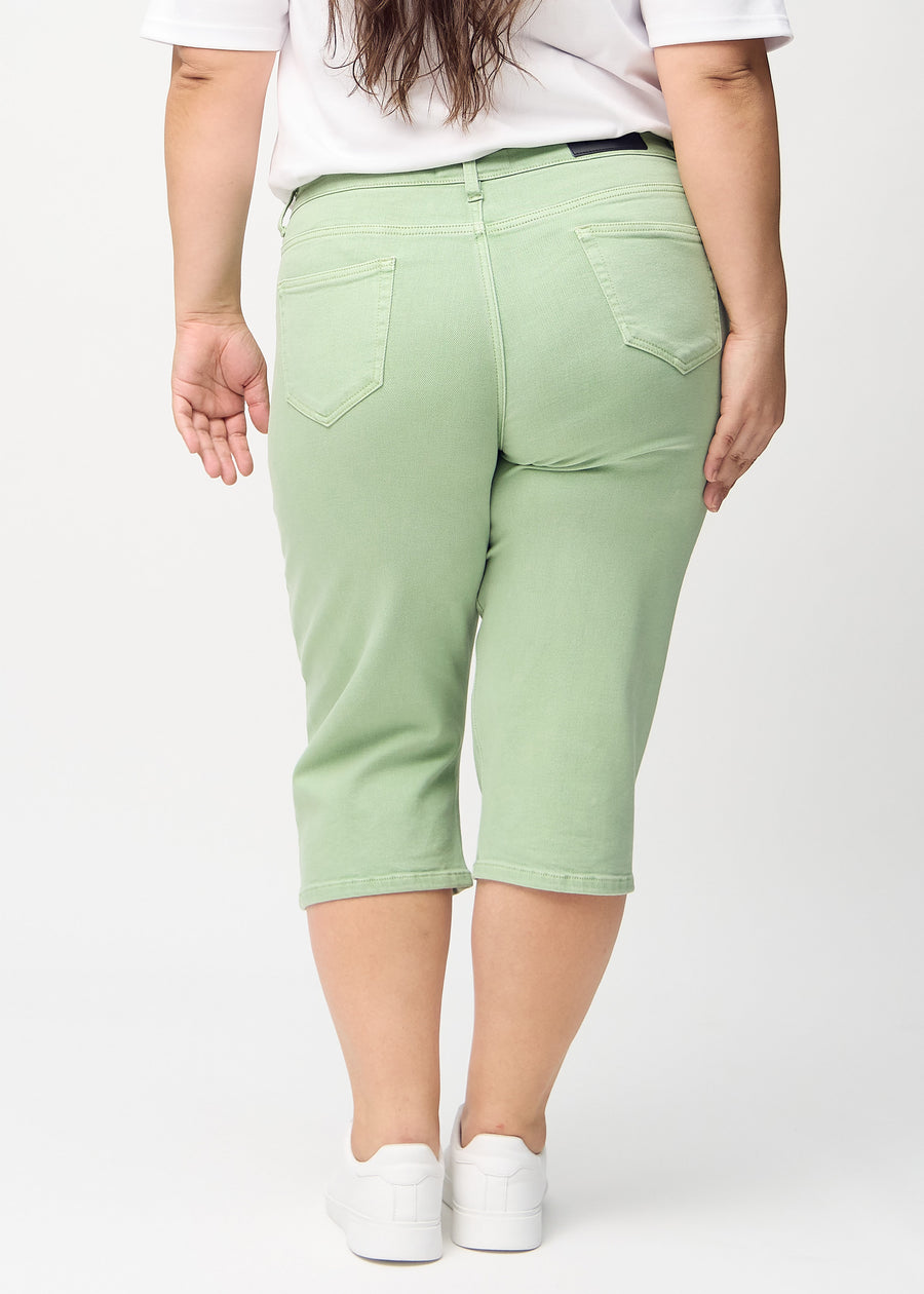 Light green regular capris seen from the back on a plus-size model, so the full product is visible.