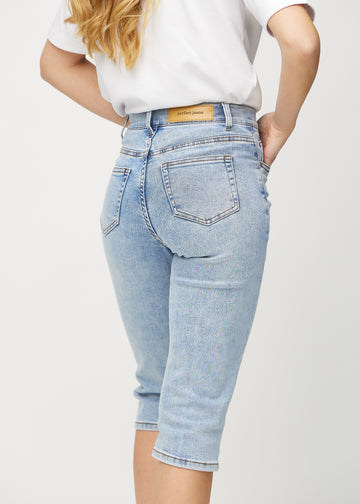 Light denim regular capris seen from the back in close-up to show details.