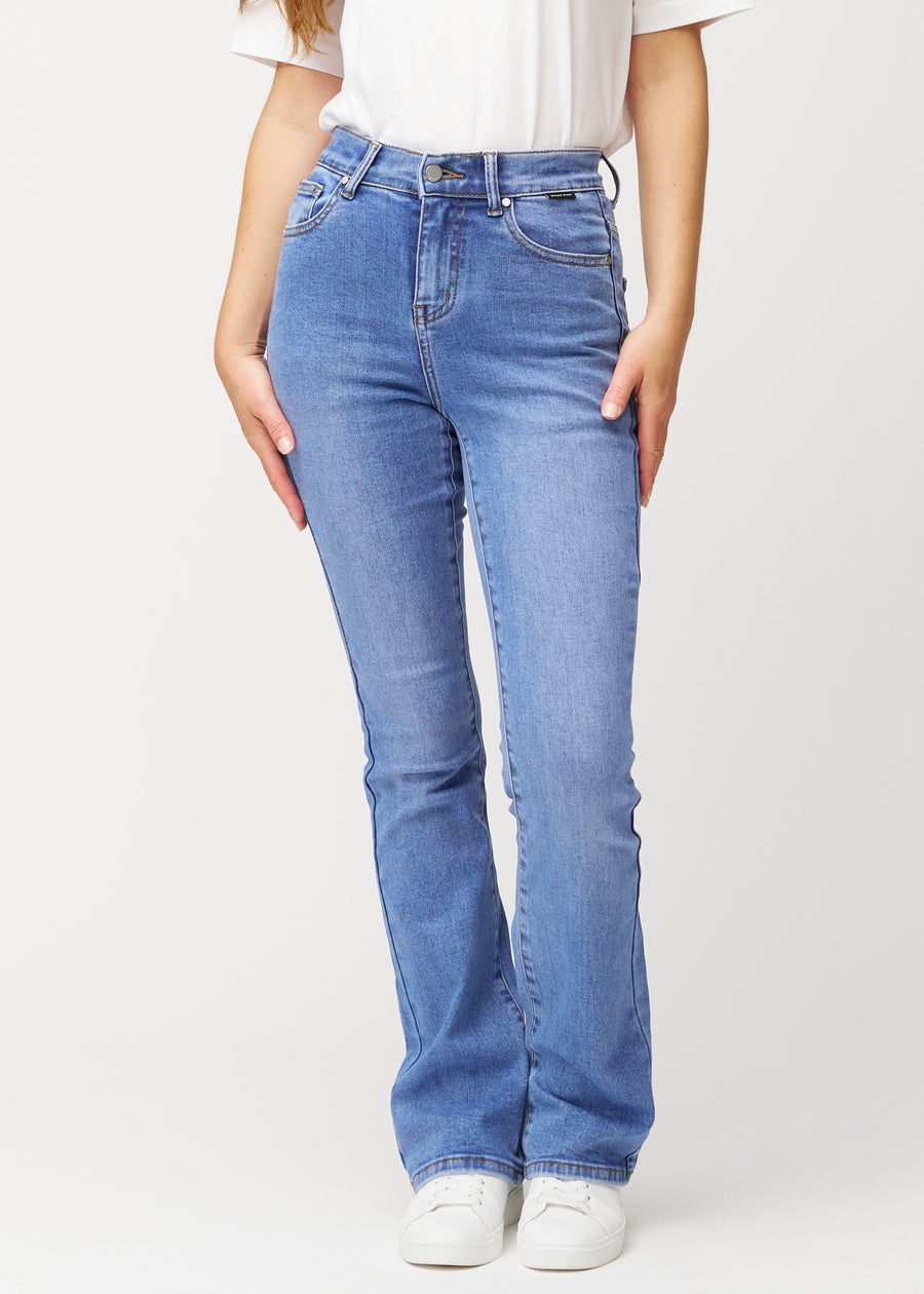 Blue mid-rise bootcut jeans in Rivers. Front view on a model, fitted through the hips and thighs with a gentle flare at the hem.