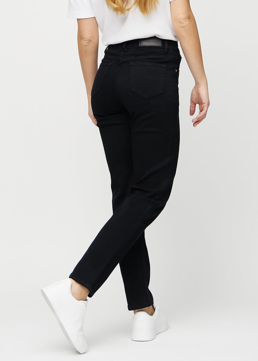 Regular jeans for women in black, color Ravens. Back view on a model, showing the full fit.