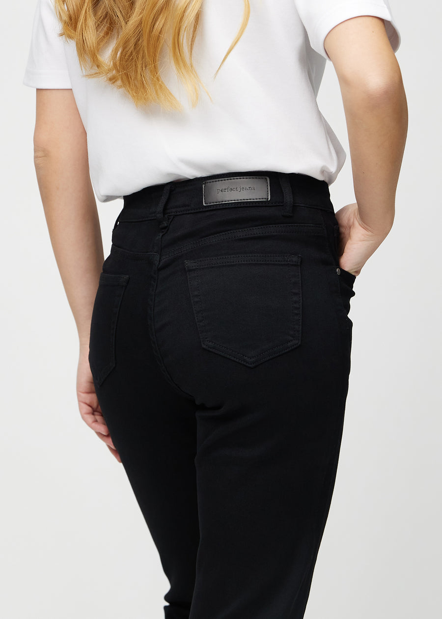 Regular jeans for women in black, color Ravens. Close-up from behind on a model, showing fit and details.