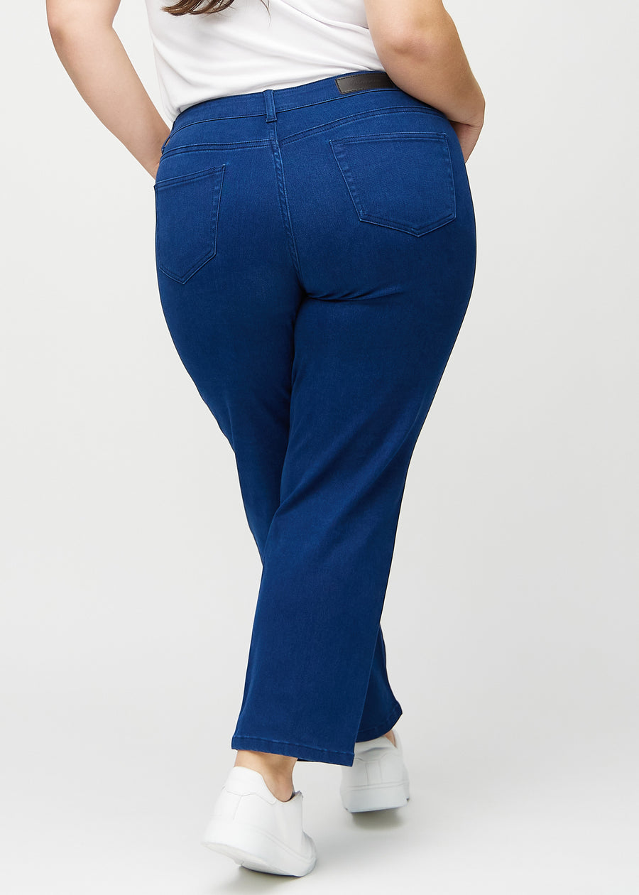 Regular jeans for women in dark blue, color Royals. Back view on a plus-size model, showing the full fit.