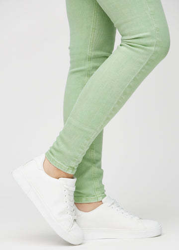 The ankles of a model, so you can see how tightly the jeans fit.