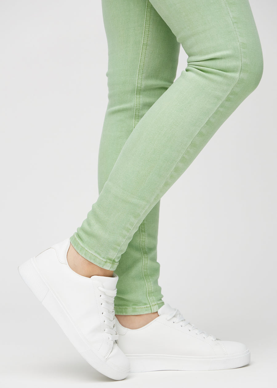 The ankles of a model, so you can see how tightly the jeans fit.