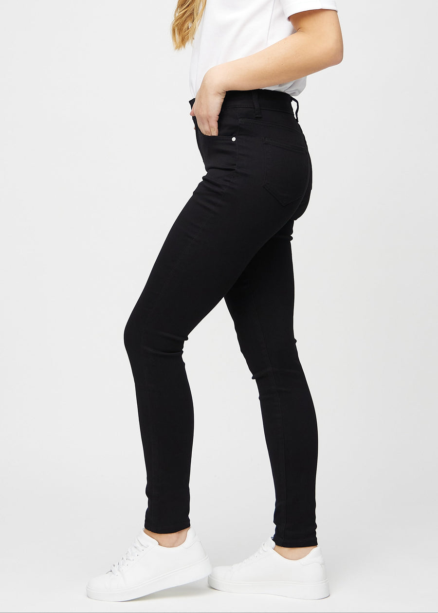Skinny jeans for women in black, color Ravens. Side view on a model.