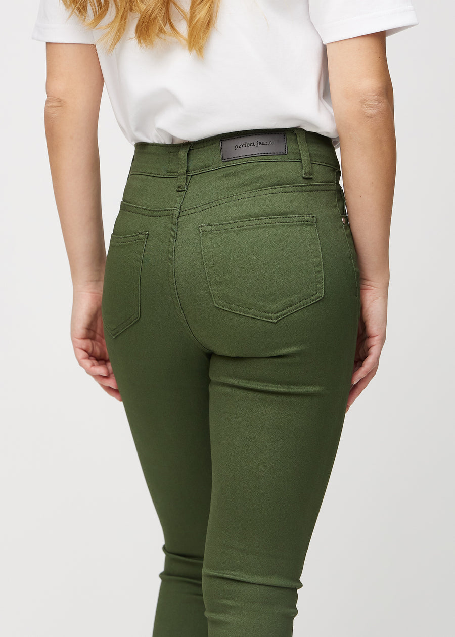 Skinny jeans for women in dark green, color Renewals. Close-up back view on a model, showing the details.