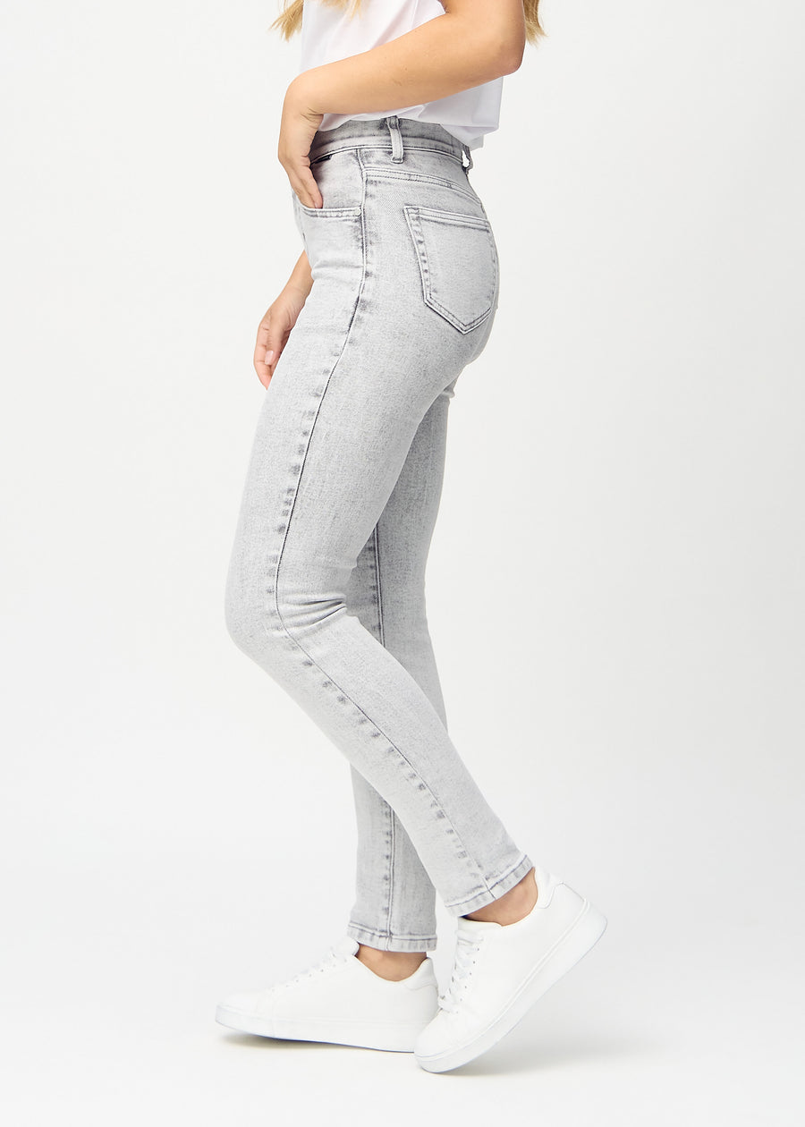 Slim jeans for women in light grey, color Ashes. Side view on a model.