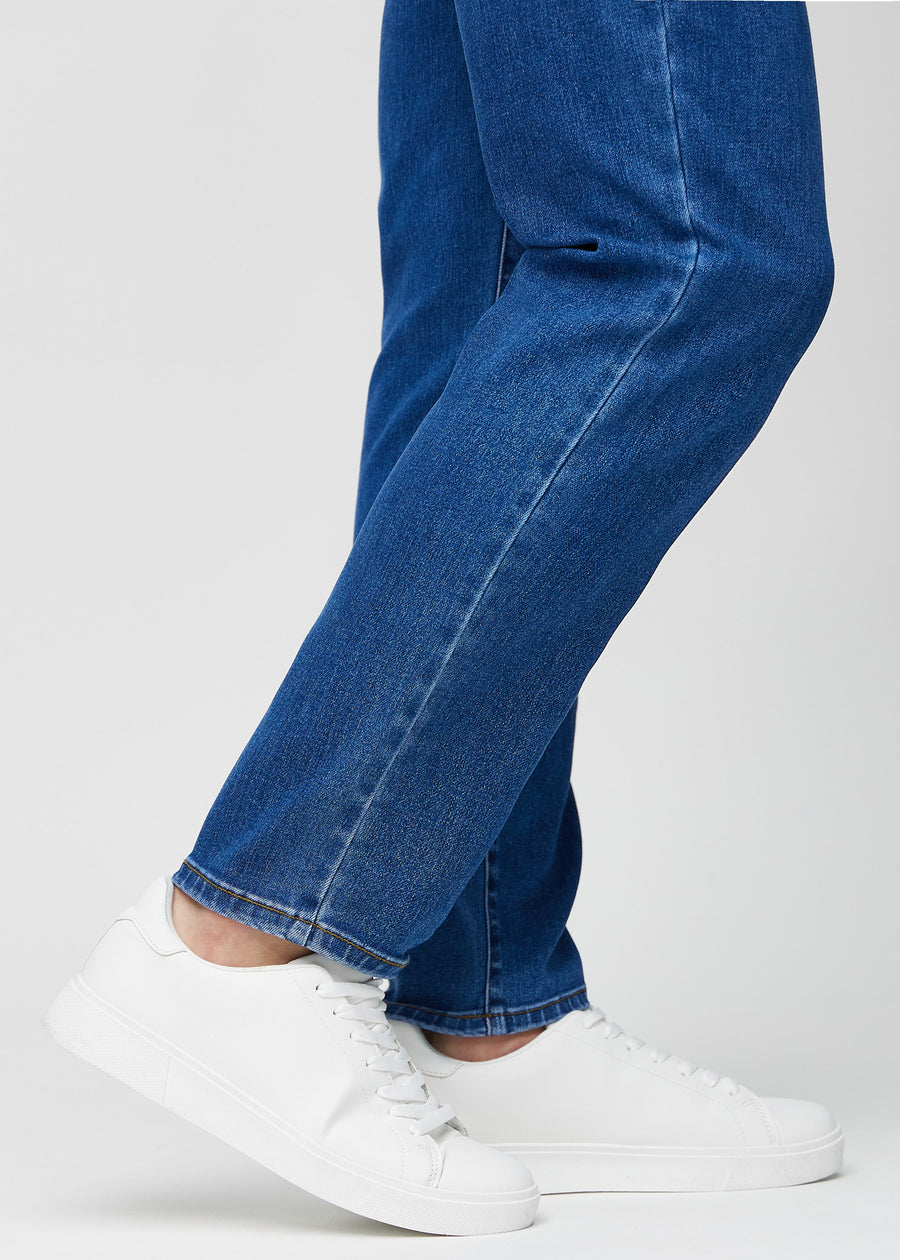 The ankles of a model, so you can see how loose the jeans fit.