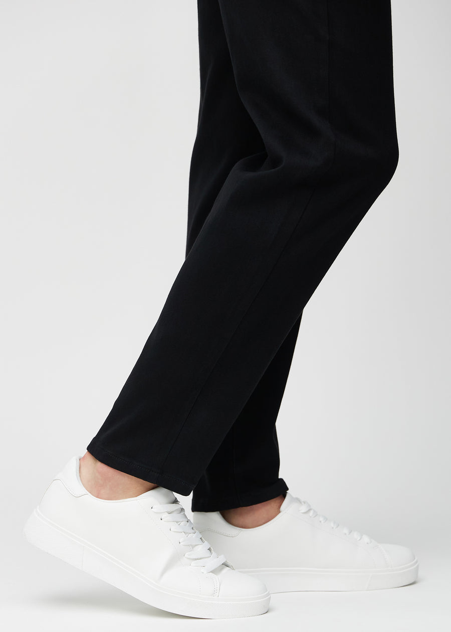 The ankles of a model, so you can see how loose the jeans fit.