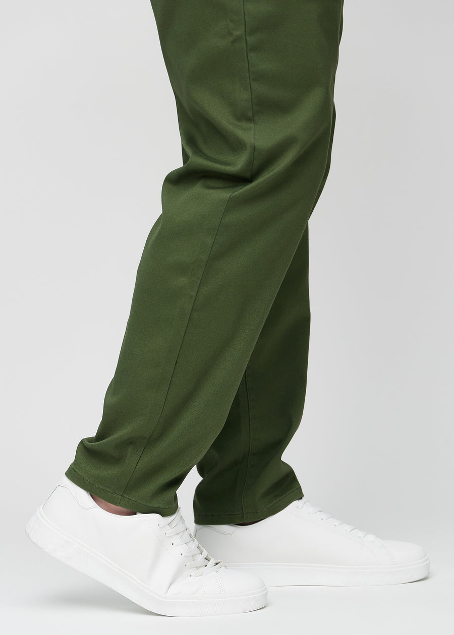 The ankles of a plus-size model, so you can see how loose the jeans fit.