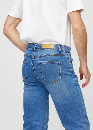 Denim regular jeans seen from the back close up to show details.