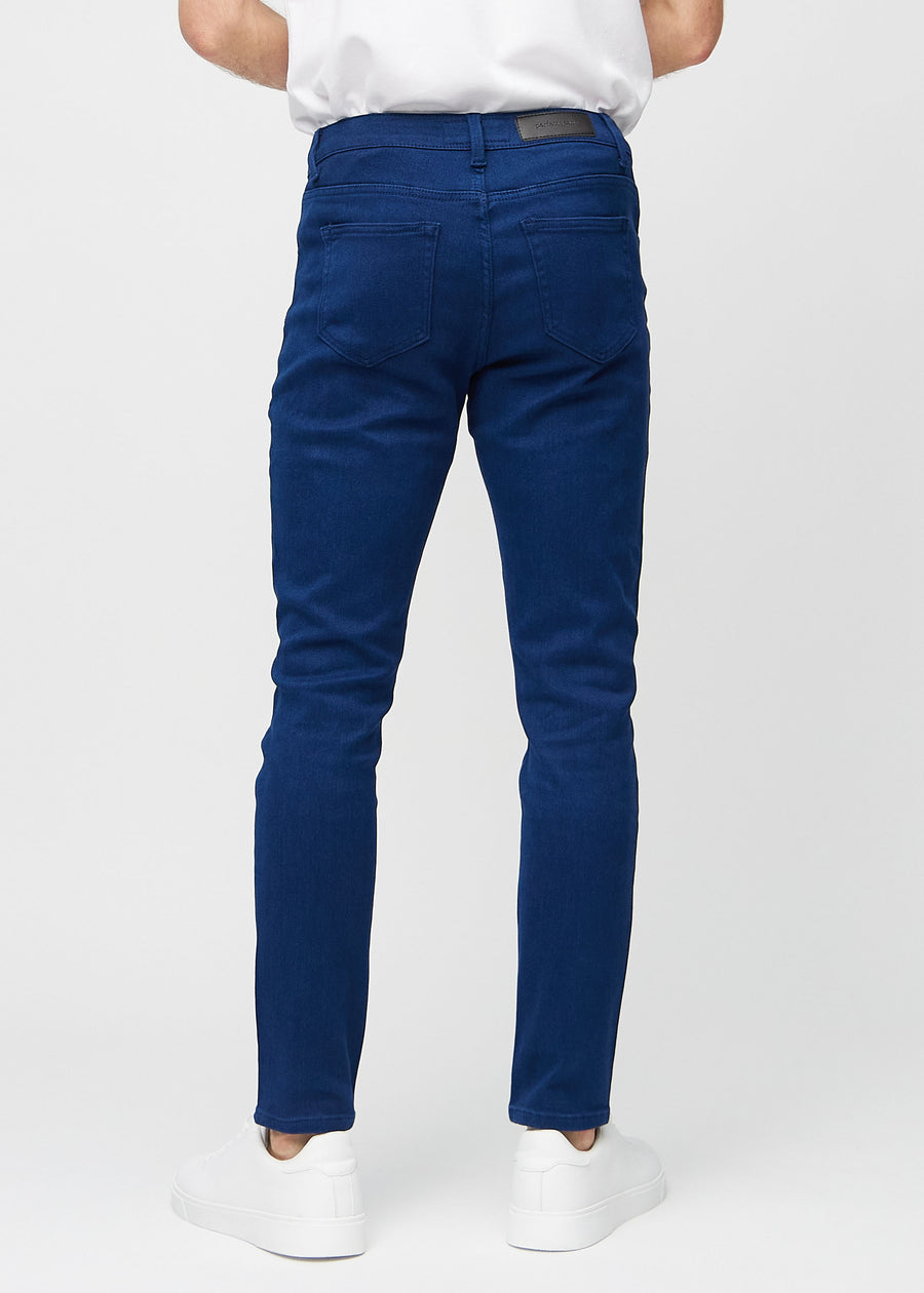 Dark blue slim jeans viewed from the back to show the full product.