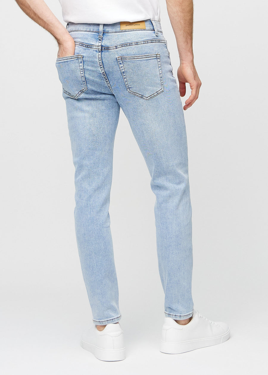Light blue denim slim jeans viewed from the back to show the full product.